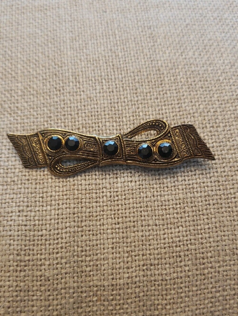 Vintage-Inspired Gold Tone Bow Brooch with Black Faceted Accents